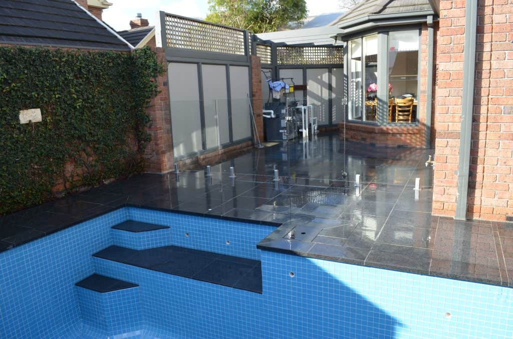 Glass Tiles Blue with Black Granite Pavers