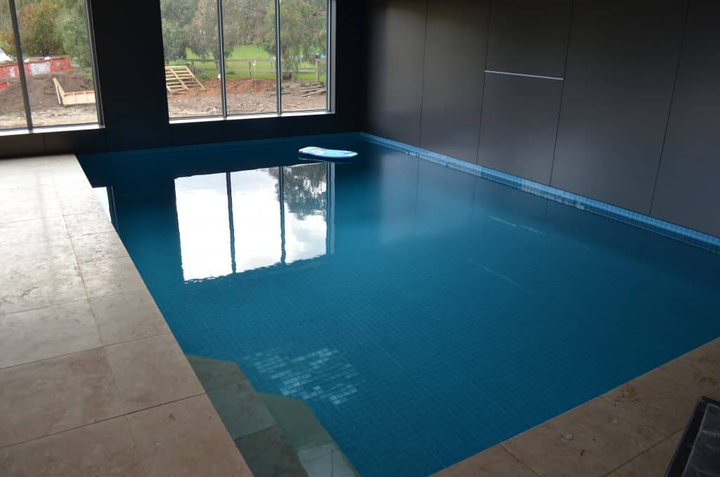 Swimming Pools Tiled In Blue Glass Tiles