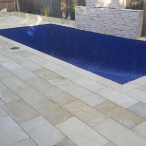 Natural suede sand poolside coping