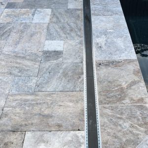 pool with silver French travertine coping