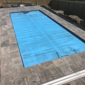 Dark shade travertine coping Melbourne
