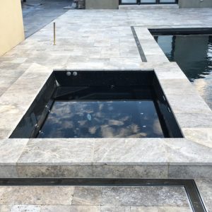 Silver raiser poolside spa coping