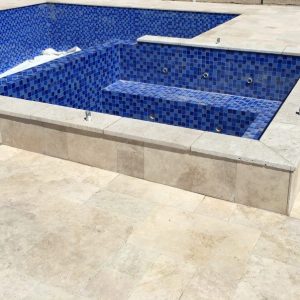 Classic poolside travertine coping